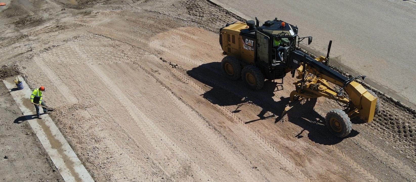 Bermea Construction equipment grading and shaping a large site