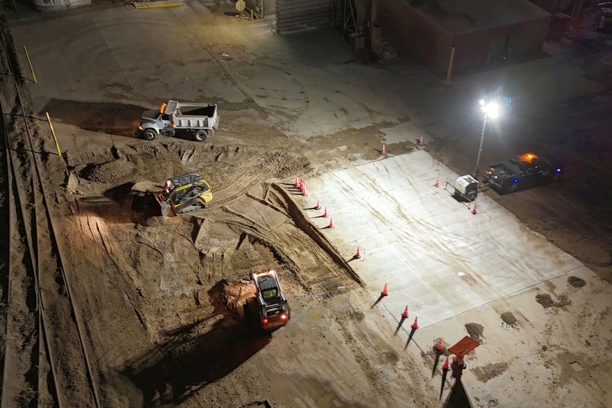 A large volume pour finished under light towers so the facility stays open by day