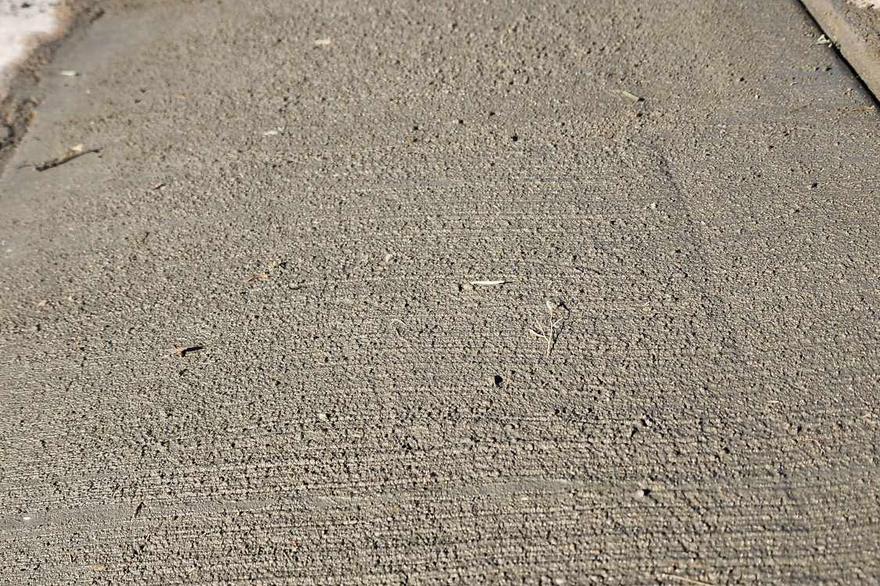 Finished concrete surface with a clean, uniform broom finish