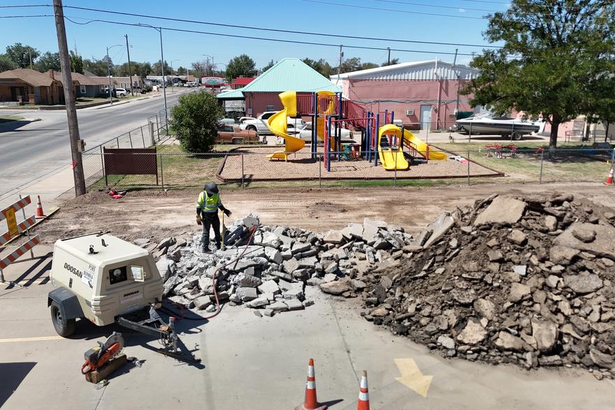 Concrete and asphalt demolition debris being loaded out