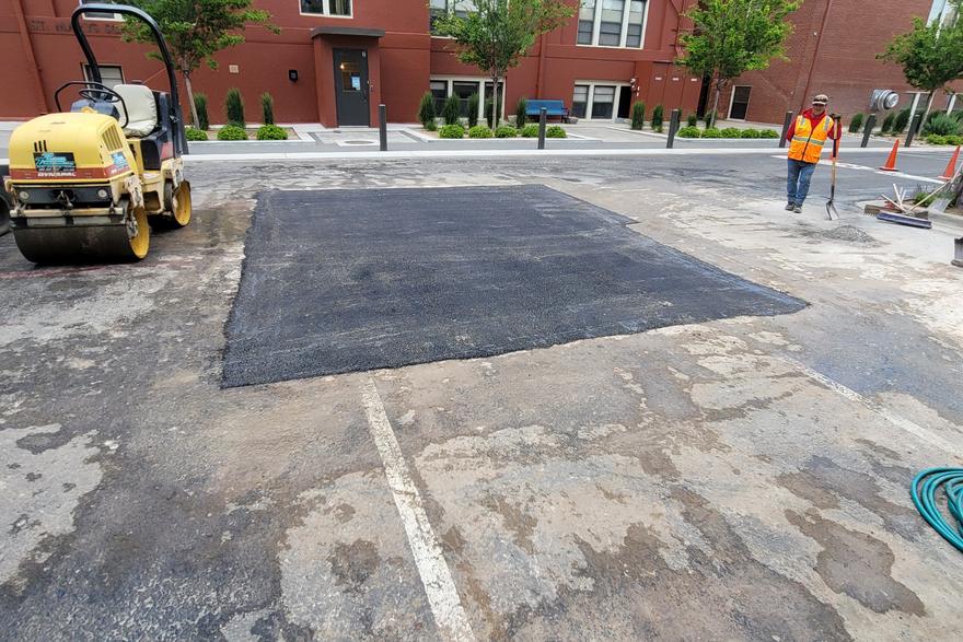 Concrete and asphalt tied together at a commercial building