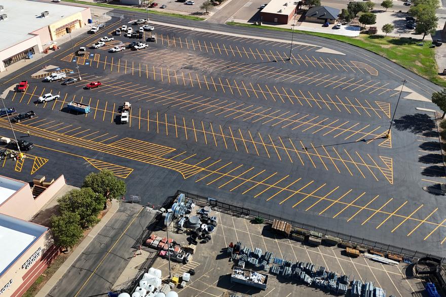 Paving, sealing, and full striping layout on a retail parking lot.